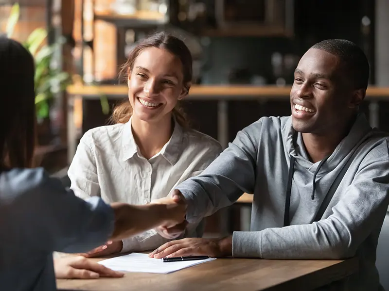 couple getting a loan from a banker