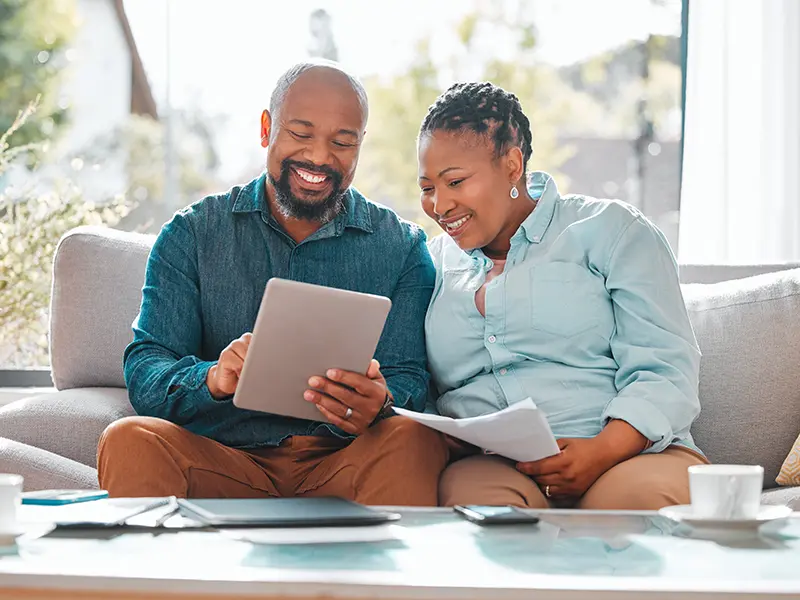 couple looking at tablet